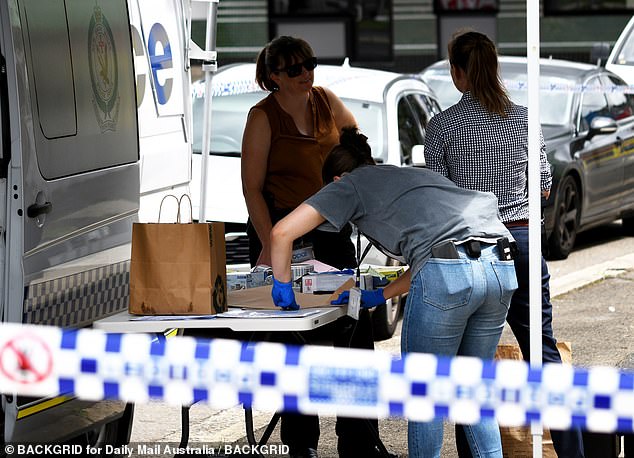 Police were led to the Taekwondo studio after discovering Mr Cho's body at a house in North Parramatta, where they allege Yoo strangled Ms Cho and the child (pictured, police at the scene).