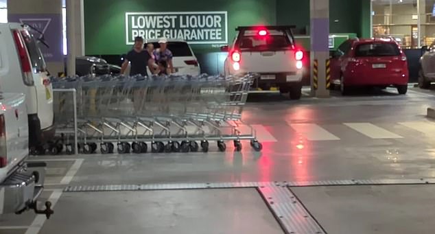 A photo shared on social media shows a row of ALDI self-service trolleys chained to an assigned stall, but the queue is so long that it overflows and blocks half the road inside the car park.