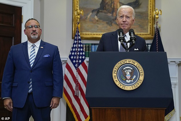 Secretary of Education, Miguel Cardona, with President Biden at the White House.  The new draft proposal includes multiple factors that the secretary can consider to determine whether borrowers face financial hardships that would qualify them for student loan relief.