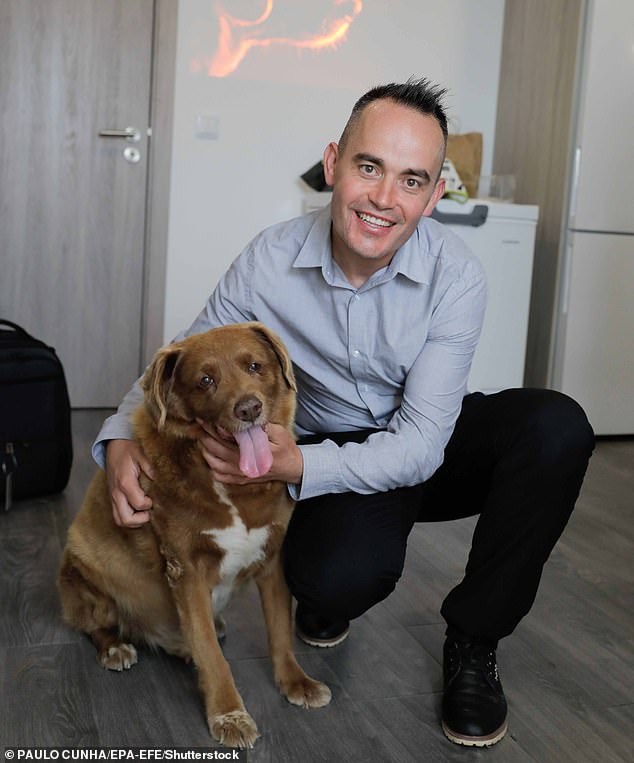 Following complaints from some veterinarians who raised questions about its age, Guinness World Records last month began a formal review of the title issued last February.  In the photo, Bobi and her owner, the Portuguese Leonel Costa.