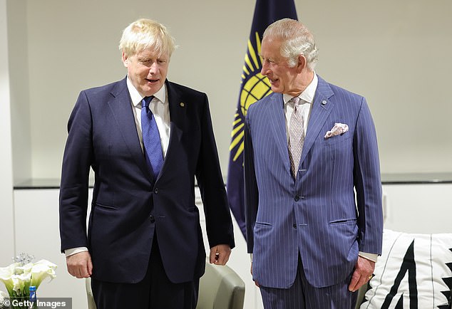 Dispute: then Prime Minister Boris Johnson (left) and Charles (right) in Rwanda in June last year