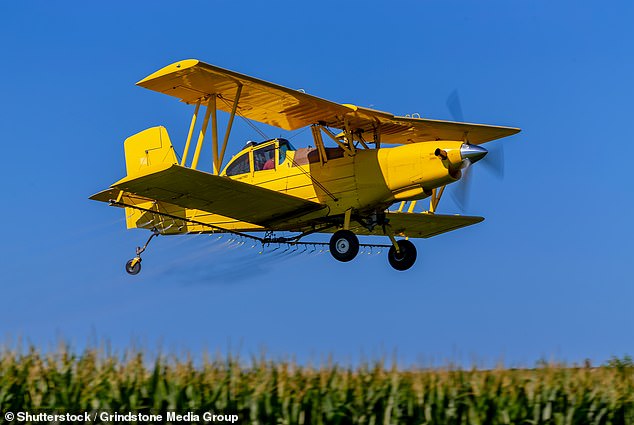 Police said officers from the North Central District found that a crop dusting plane had crashed in a field (file image pictured).