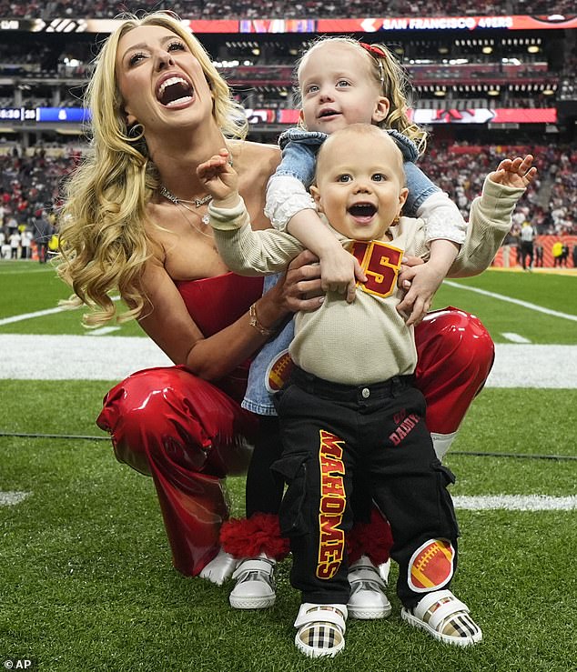 Brittany went down to the field and took a photo with her two children