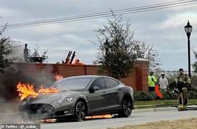 Electric car owners face rising insurance and repair costs over fears the vehicles will explode after even minor collisions (file photo of a Tesla that caught fire in the US in 2020)