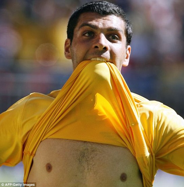 Legendary: John Aloisi celebrates victory over Japan in the 2006 World Cup group stage... an iconic moment for Socceroo
