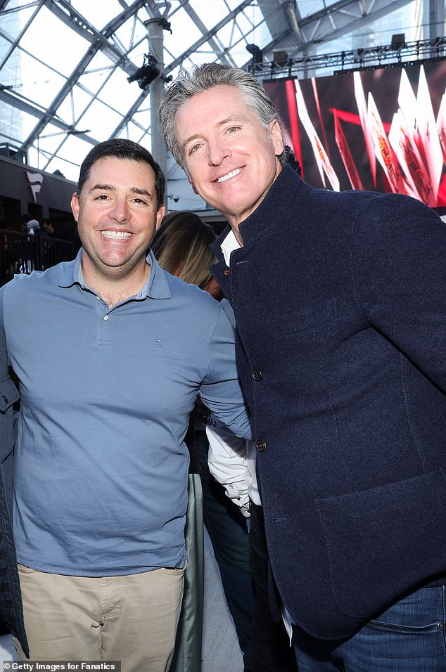California Governor Gavin Newsom is pictured with San Francisco 49ers CEO Jed York in Las Vegas on Saturday night as the couple attended a Super Bowl party.