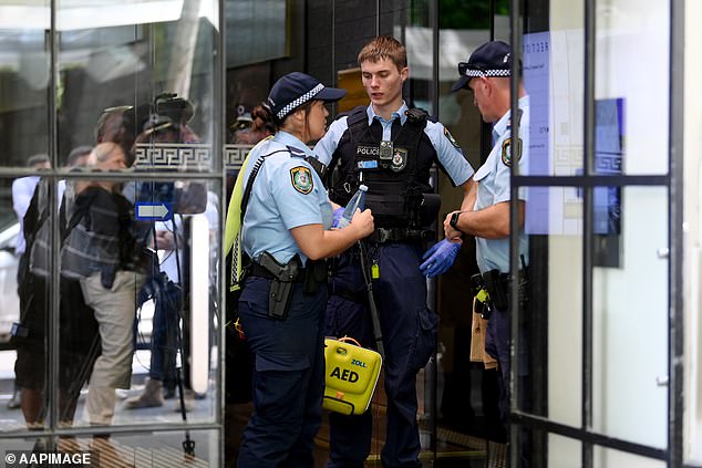 New South Wales Police are seen following a shooting on Castlereagh Street in Sydney, Wednesday February 28, 2024.