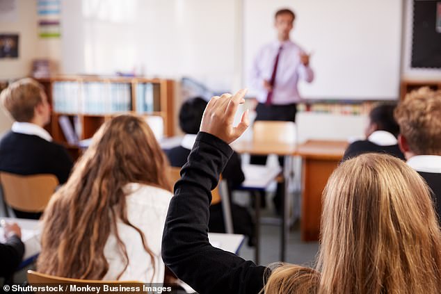 Furious parents have claimed the use of teaching materials in sex education classes for children as young as 14 tells pupils that gender transition would prevent them from being bullied (file photo)