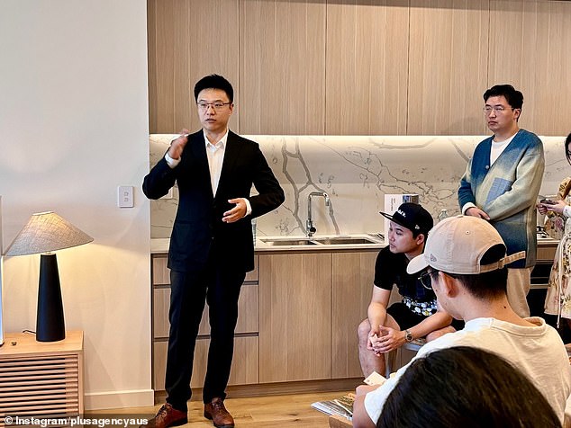 A property group marketing Australian properties to wealthy Asian investors made the revelation after the Labor Party announced a crackdown on foreign investors buying real estate without living locally (pictured, a Plus Agency agent working in Sydney).