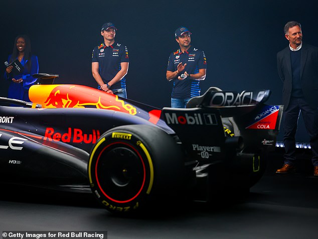 Horner (right) pictured at the launch of Red Bull's new car in Milton Keynes on Thursday in his first public appearance since the allegations emerged.