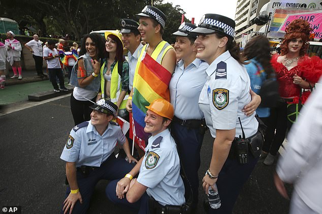 Police officers will be allowed to march in this Saturday's Mardi Gras parade in Sydney after event organizers backtracked on a decision made this week (pictured, police at Mardi Gras)