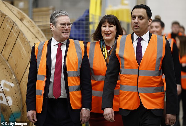 Labor leader Keir Starmer, shadow chancellor Rachel Reeves and Scottish Labor leader Anas Sarwar, meet staff at a Siemens factory specializing in rail infrastructure, on March 10 2023 in Glasgow