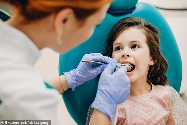 Dentists will be sent to schools to treat children's teeth and will be given bonuses for taking on new NHS patients under government plans (Stock Photo)