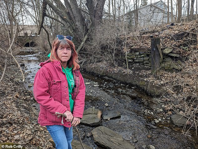 Krissy Ferguson's home in East Palestine sits just above Sulfur Run Creek, which was contaminated when a train carrying toxic chemicals derailed less than a mile away.