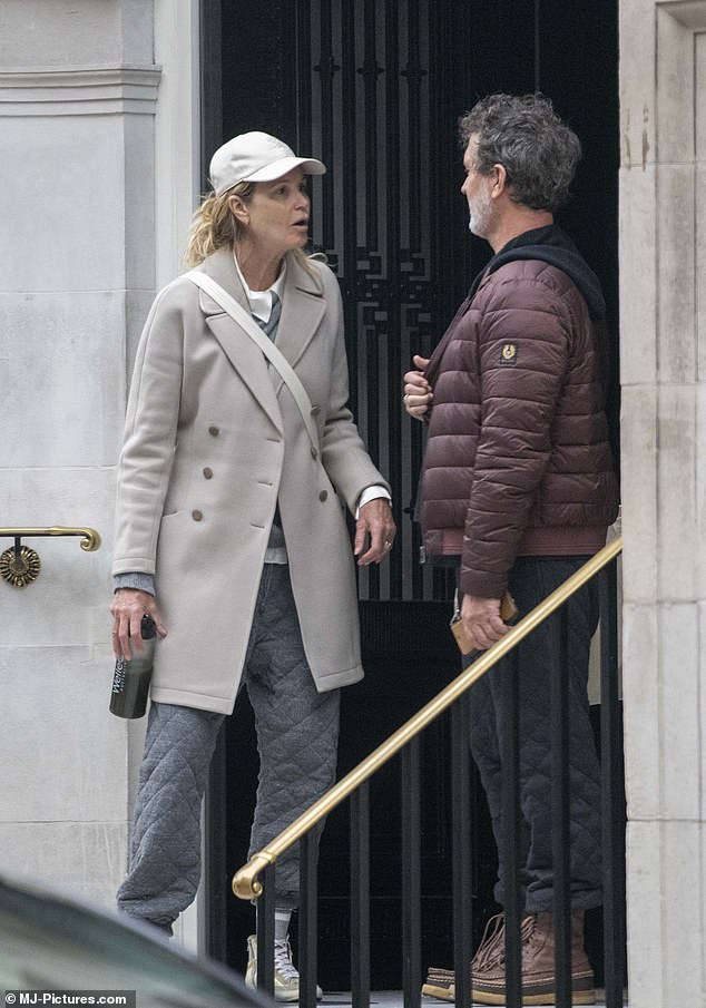 Elle Macpherson appeared to be having a passionate argument with her boyfriend Doyle Bramhall on Tuesday as they left The Twenty Two hotel in Mayfair, London.