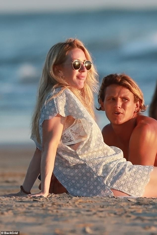 Ellie Goulding appeared smitten with surf instructor Armando Pereza while on vacation in Costa Rica this week, after announcing her split from husband Caspar Jopling.