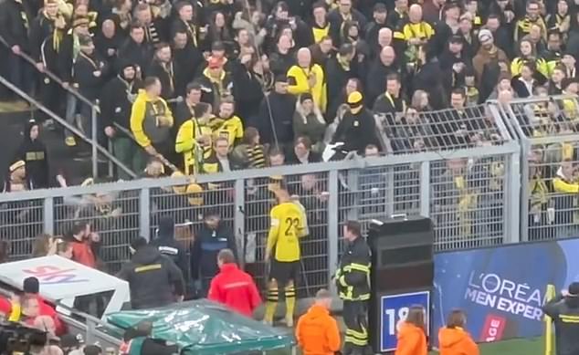 Emre Can was seen talking to fans inside Signul Iduna Park after Dortmund's match against Freiburg was suspended due to unrest among fans.