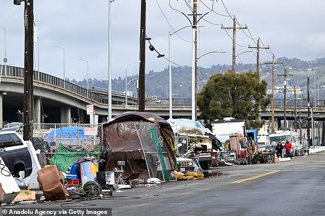 A view of a homeless encampment on a street in West Oakland, California.  The state has the largest homeless population in the US.