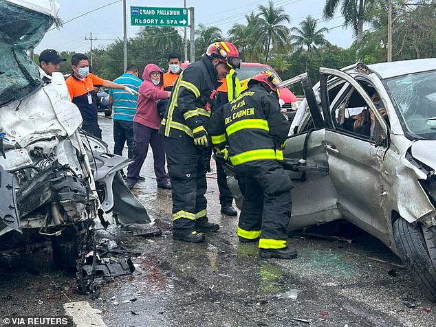 Firefighters inspect the SUV that was transporting the five Argentine tourists who died on Sunday on a highway that connects Playa del Carmen and Tulum.  The SUV crashed into a parked van, killing its driver.