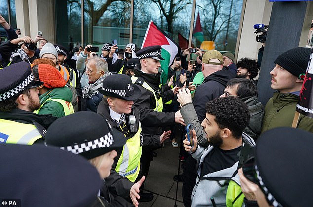 A man appeared to argue with police as the procession became unruly at Hyde Park Corner.