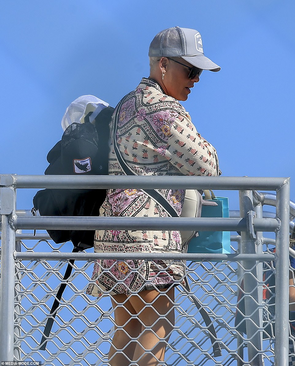 Pink and her family flew from Sydney to Queensland after being refused entry to an Australian club this week.  She is pictured landing on the Gold Coat.