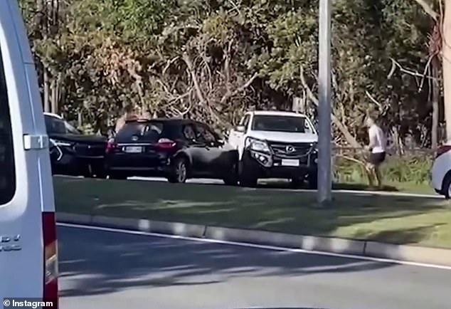 A 23-year-old man has been charged with a string of offenses after allegedly chasing men with a knife following a road rage incident on the Gold Coast on Saturday (pictured).