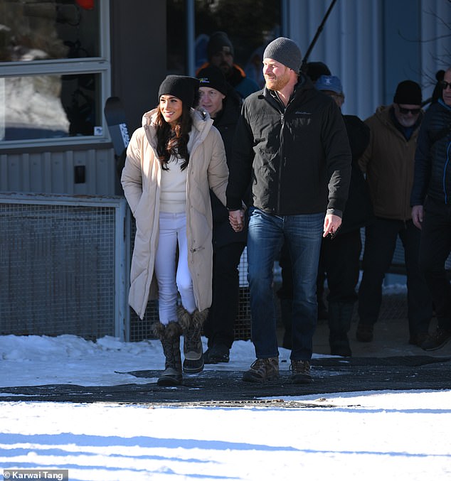 Meghan looked glamorous in skinny white jeans and a sweater topped with a beige puffer coat, while Harry wore jeans and a black anorak.
