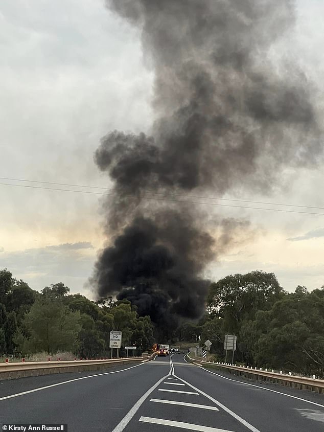Thick black smoke was seen rising from the road where the van and truck collided.