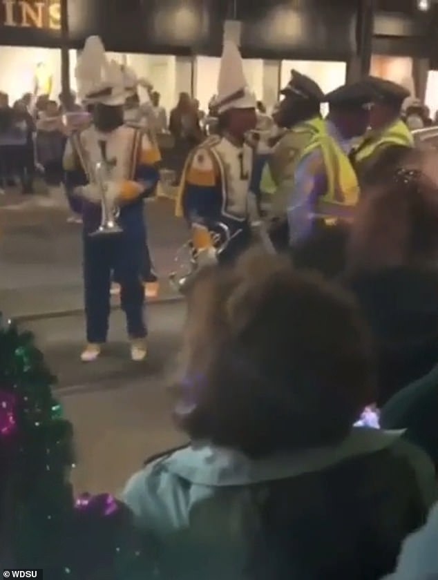 During a break in the march, a New Orleans Police Department officer is seen on video apparently elbowing the student, who was positioned right next to him at the time.