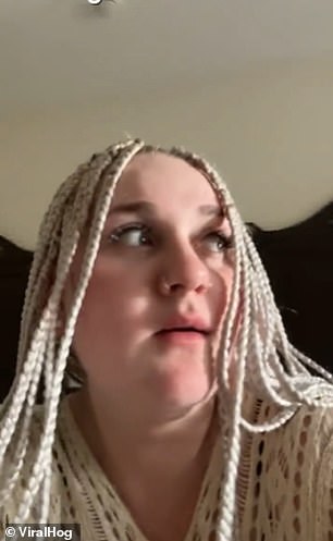The tourist, who has white dreadlocks and nose piercings, appears first in the video waiting for one of the monkeys on the balcony to enter the hotel room.
