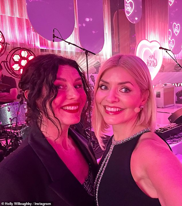 Holly showed off a selection of snaps from the charity gala as she helped organize a huge auction to raise funds for a new Children's Cancer Center (pictured with make-up artist Patsy O' Neil)