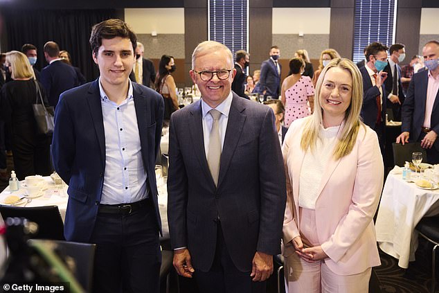 If he wins on Saturday, Anthony Albanese would make history as Australia's first prime minister to be divorced or separated after a marriage breakdown (the Labor leader appears center with his son Nathan and girlfriend Jodie Haydon).