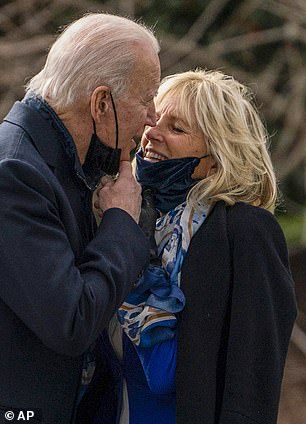 President Joe Biden kisses First Lady Jill Biden before boarding Marine One on January 29, 2021