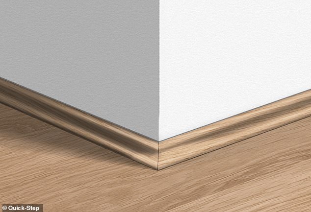 The image above shows the laminate flooring and then the scotch where it meets the baseboard. Most good laminate floors can be chosen with a fine scotch to match the wood design.