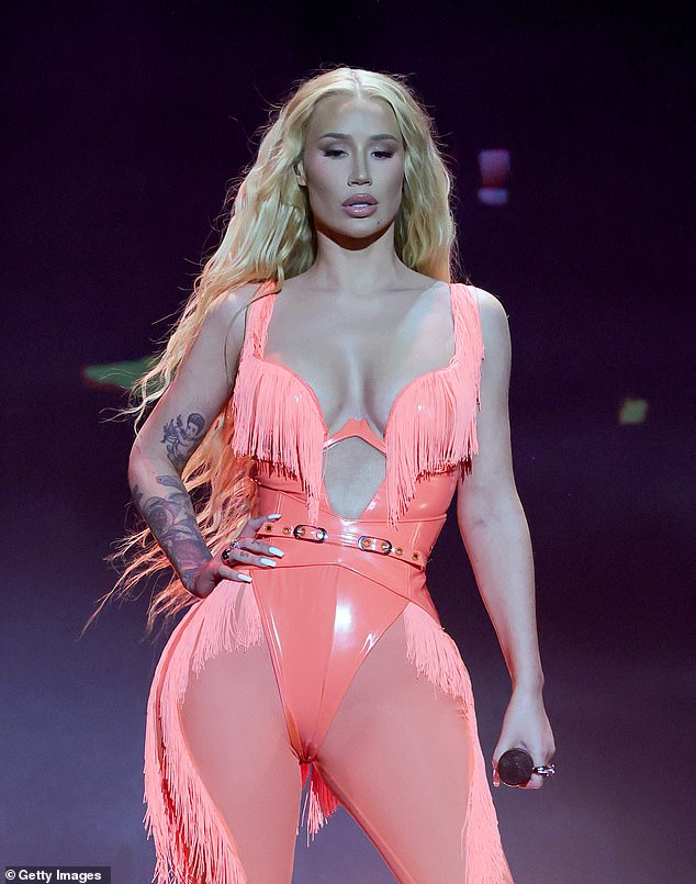 Iggy Azalea, 33, (pictured) took a scandalous swipe at baby daddy Playboi Carti after criticizing his parenting skills.