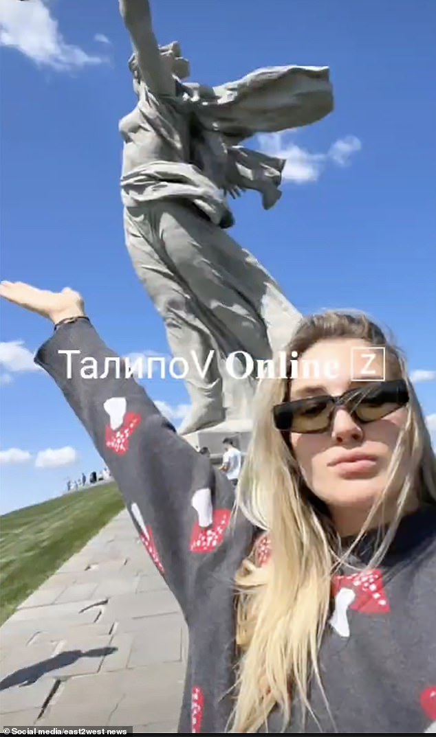 Agafonova posed under the statue. She was placed on Russia's wanted list and was detained this week when she returned to her homeland.