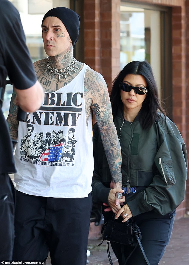Kourtney Kardashian, 44, (right) and her husband Travis Barker, 48, (left), are reportedly staying at the luxurious Calile Hotel in Brisbane, where suites can cost up to $1,800 a night.