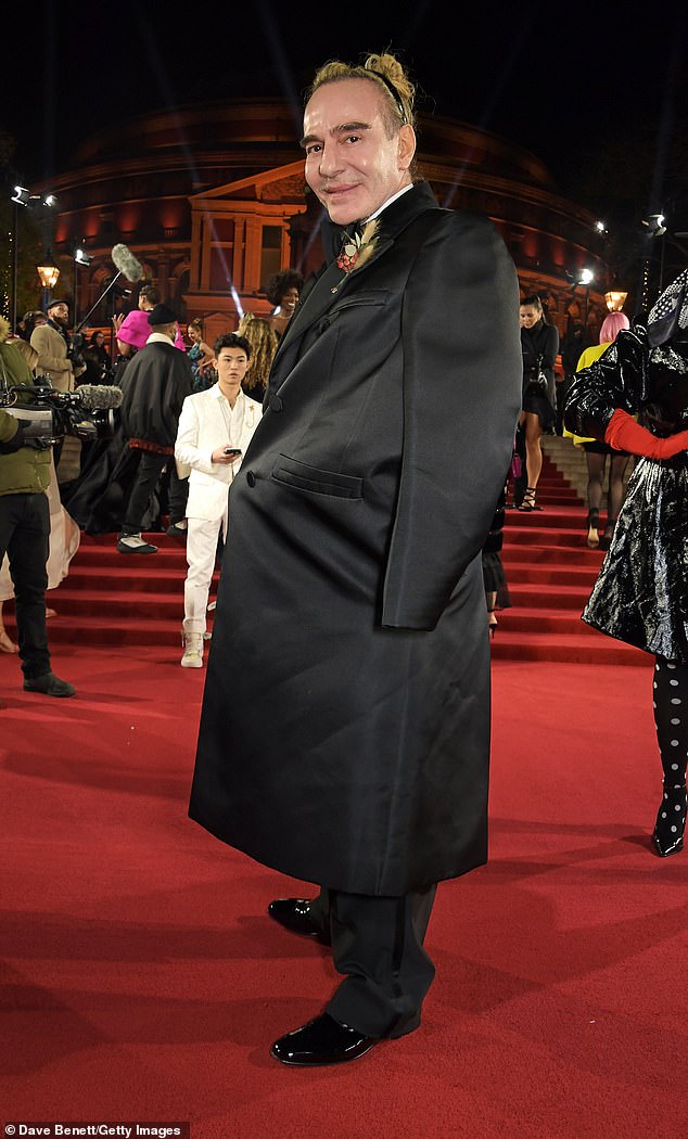 John Galliano, pictured arriving at the Fashion Awards 2021 at the Royal Albert Hall, was responsible for putting Kate Moss on the map, but interestingly, he also threw a dead plate into the crowd at LFW 1984.