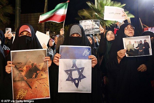 Iranians attend a rally in Tehran on Saturday in support of Palestine after Hamas militants launched a deadly air, land and sea attack against Israel from the Gaza Strip.