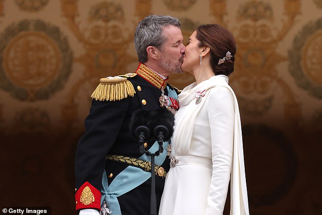 Denmark's King Frederick's decision to kiss his wife Queen Mary on the balcony of Christiansborg Castle today was far from spontaneous, a body language expert said.