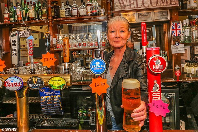 Pictured above is Mandy Merrix, manager of The Waggon and Horses pub in Oldbury, West Midlands.