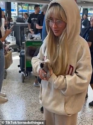 When she arrived at Melbourne Airport, she was greeted by fans who filmed her arrival.  But one detail in the video shared on the social media platform sent fans into a frenzy: The Harvard hoodie Sabrina was wearing belongs to her boyfriend Barry Keoghan.
