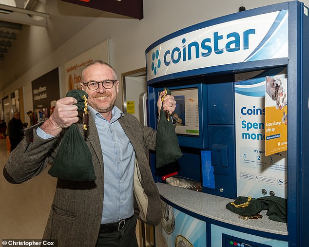 Old money bags: Toby Walne uses the Coinstar machine at his local Sainsbury's and wins £215.75... but loses £28 in commission