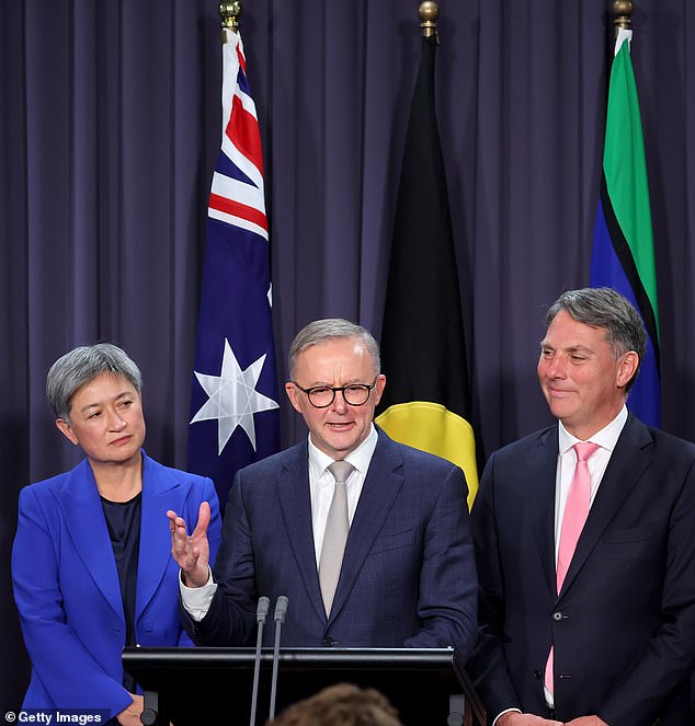 Albanese (pictured, center, Monday with Penny Wong and Jim Chalmers), Australia's 31st prime minister, will not completely get rid of deportation laws.