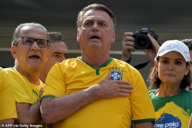Former Brazilian president Jair Bolsonaro (pictured) sings the national anthem during a rally in Sao Paulo.