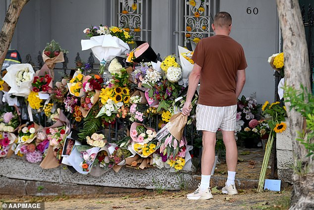 A sea of ​​flowers was left outside the house where police allege TV presenter Jesse Baird and fellow flight attendant Luke Davies were murdered (pictured)