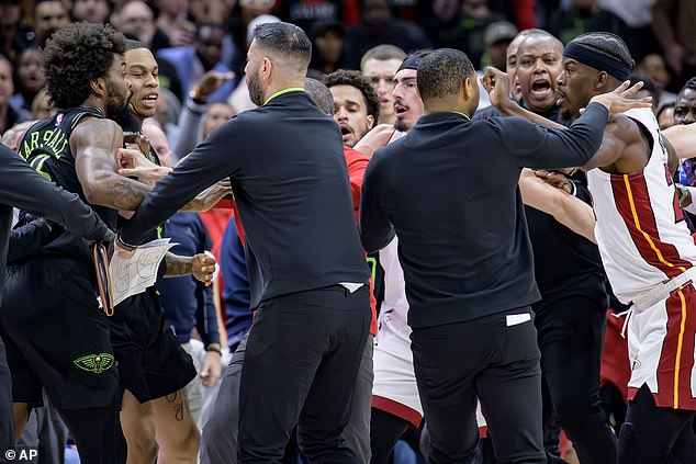 Naji Marshall (left) and Jimmy Butler (right) had to be separated during a fight in the second half on Friday.