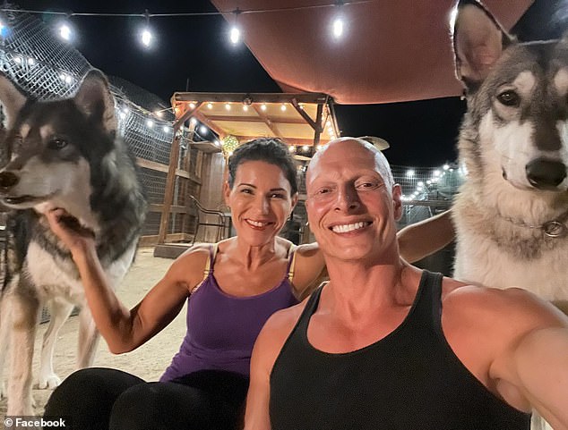 Malick accused the Los Angeles district attorney of malicious prosecution and prosecutorial misconduct. The couple appears in the photo with two huskies.