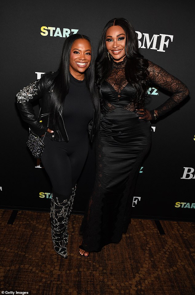 Kandi Burruss reunites with Real Housewives of Atlanta star Cynthia Bailey on the red carpet at a special screening of BFM