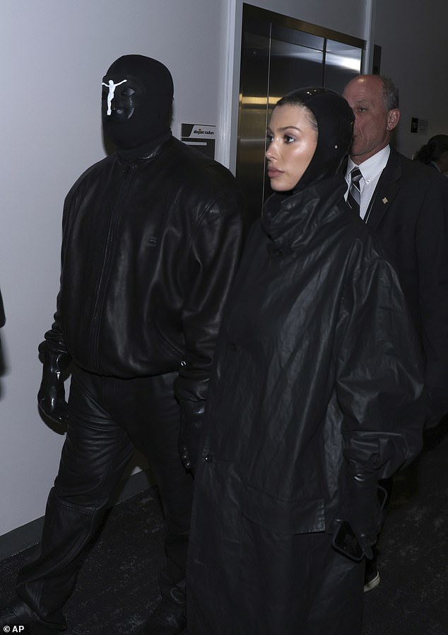 Kanye West steps into enemy territory! Rapper wears mask with wife Bianca Censori at Super Bowl where rival Taylor Swift is holding court… and his ex-wife Kim Kardashian is also in attendance amid hot new romance